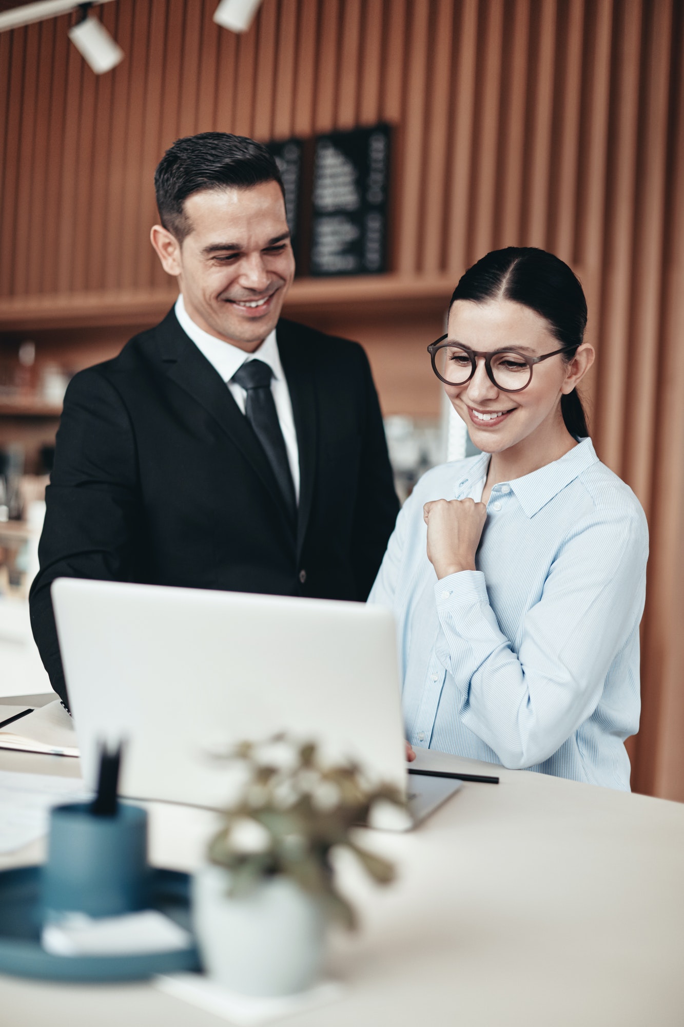 two-smiling-businesspeople-using-a-laptop-together-in-an-office.jpg two-smiling-businesspeople-using-a-laptop-together-in-an-office.jpg